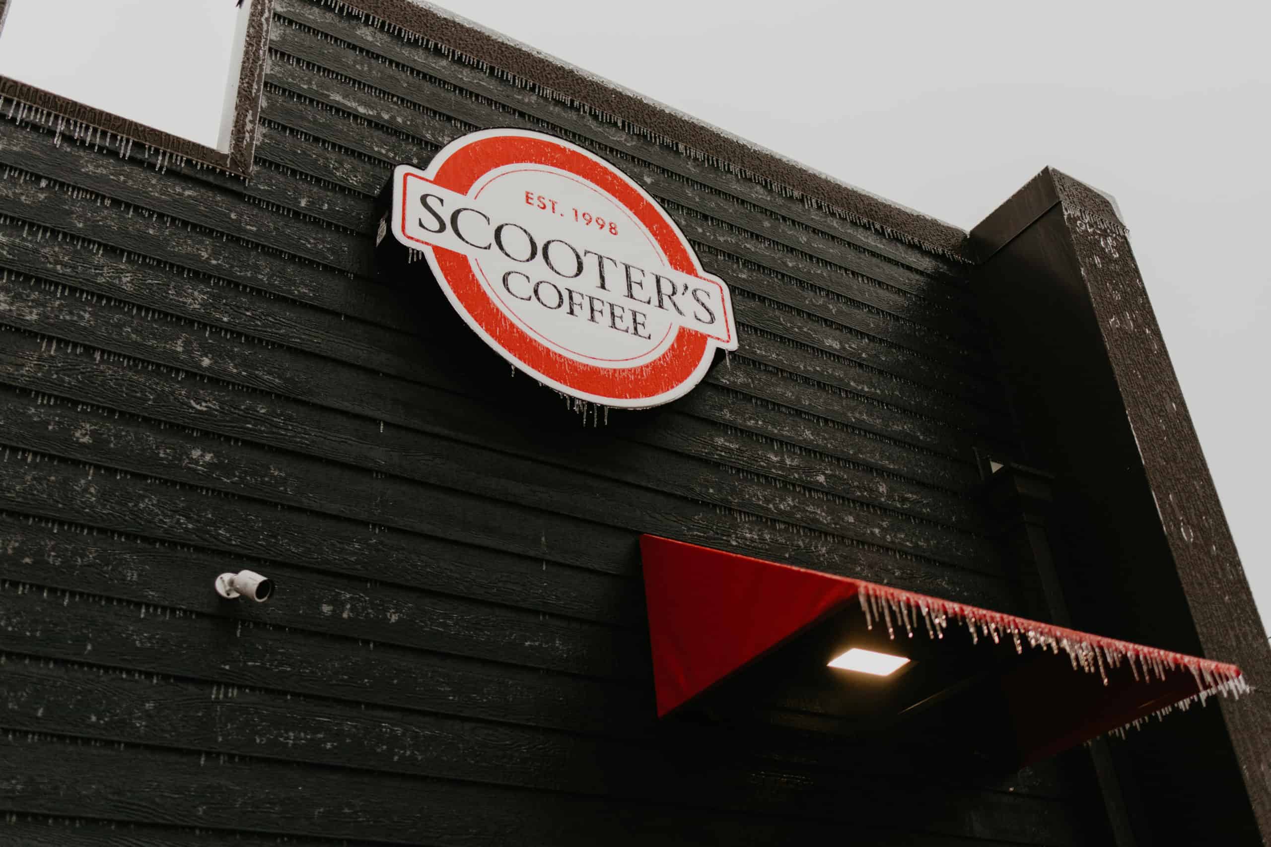 Scooter's Coffee sign on a drive-thru coffee kiosk.