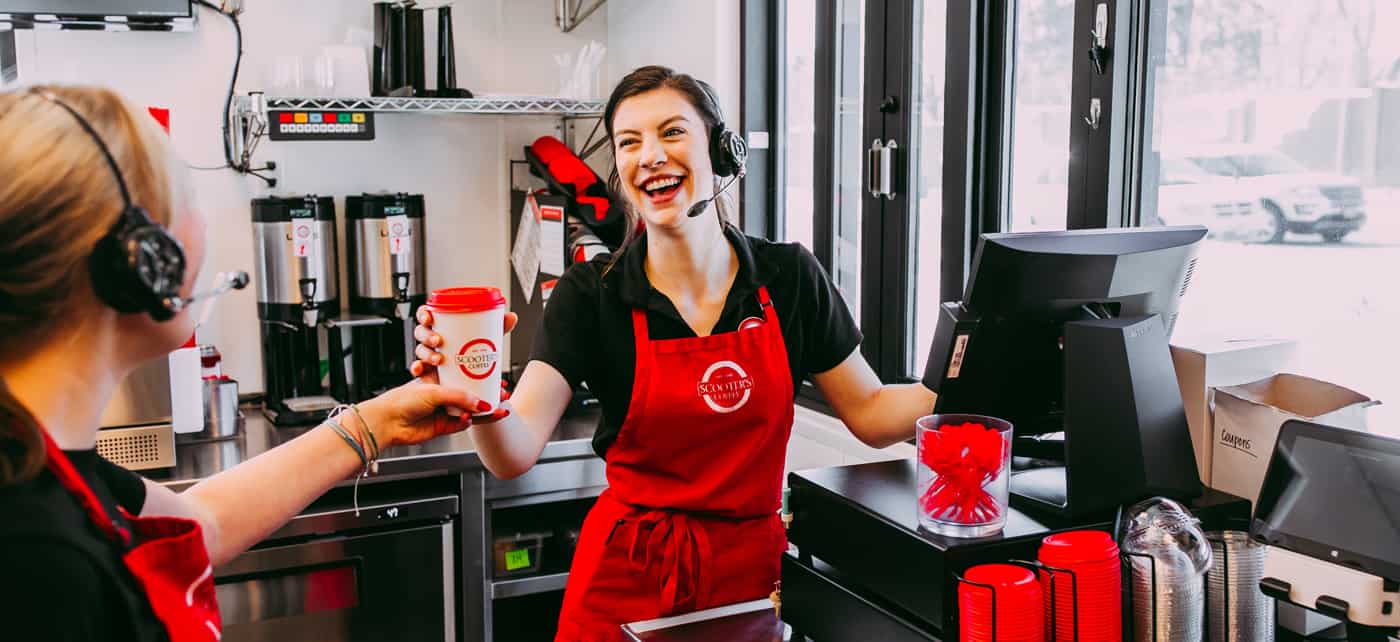 Scooter's Employee Serving Coffe